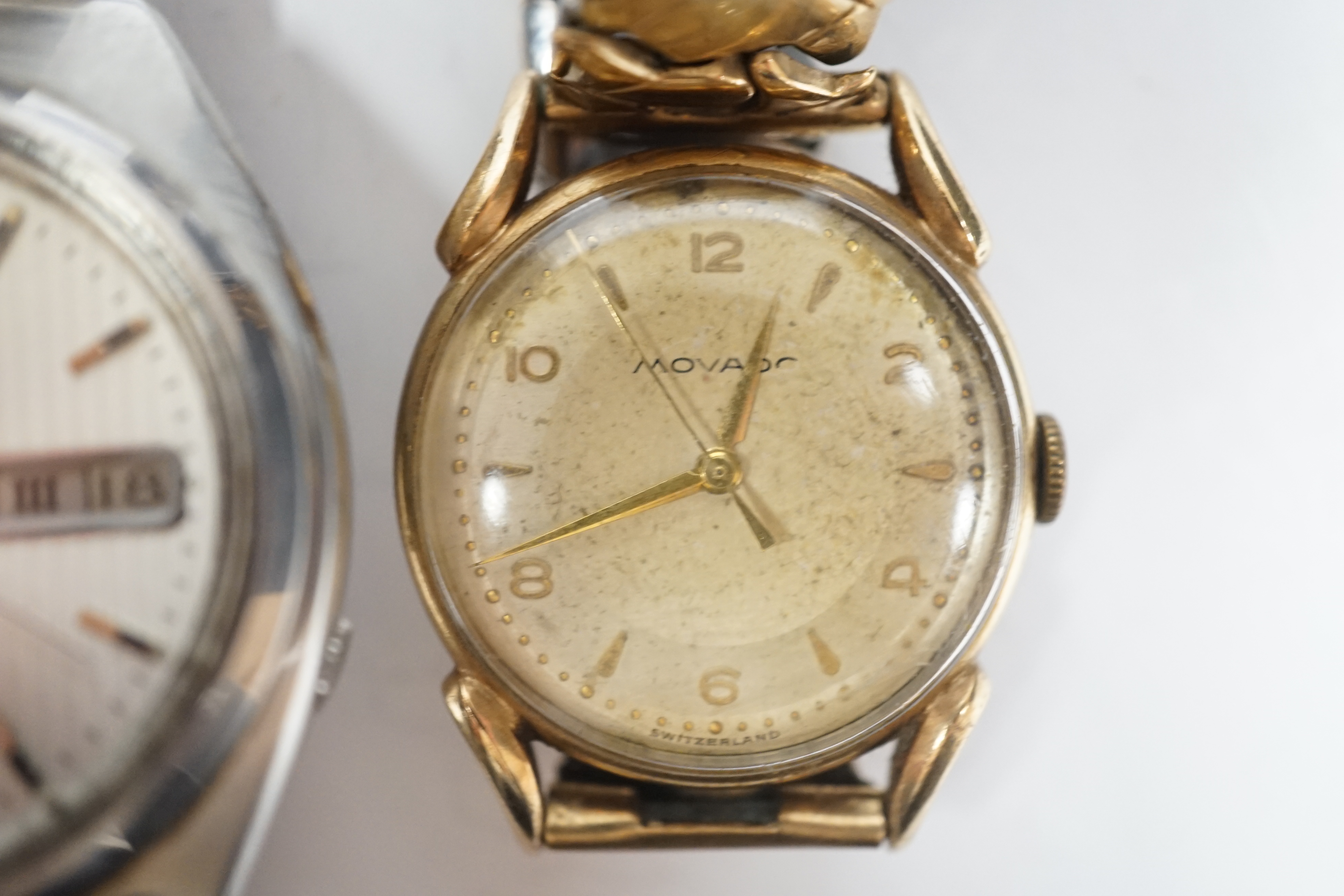 A gentleman's 9ct gold Movado manual wind wrist watch, on associated steel and gold plated flexible strap and a gentleman's stainless steel Seiko 5 automatic wrist watch.